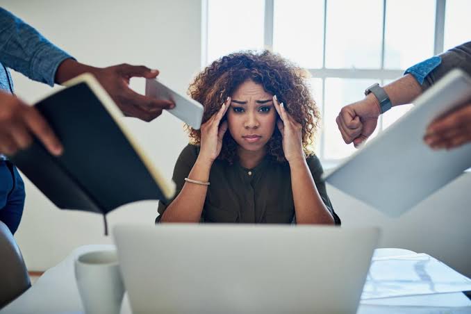 A woman stressed out because of her work