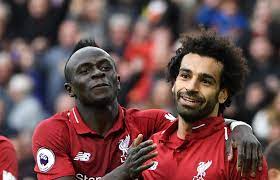 A picture of Mo Salah and Said Mane playing together as a representation of unity