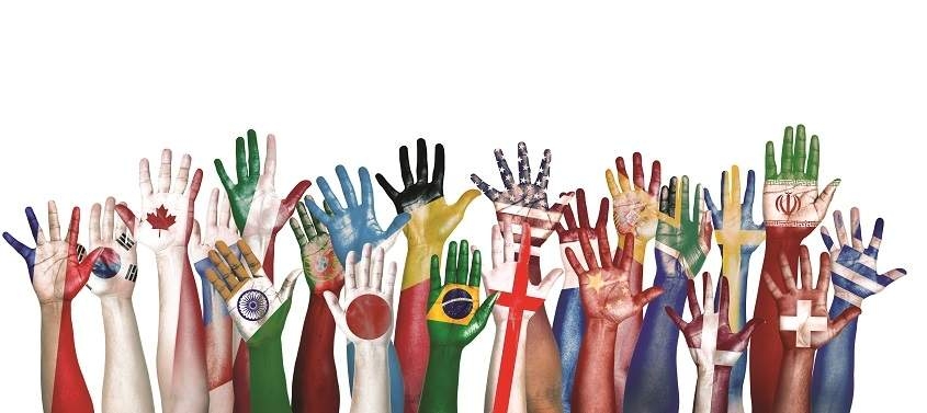 Picture of many hands of flags of many countries to show cultural diffrences