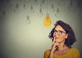 A woman thinking and the idea is a light bulb