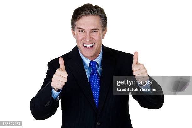 Horizontal composition of a mature businessman gesturing thumbs up and smiling
