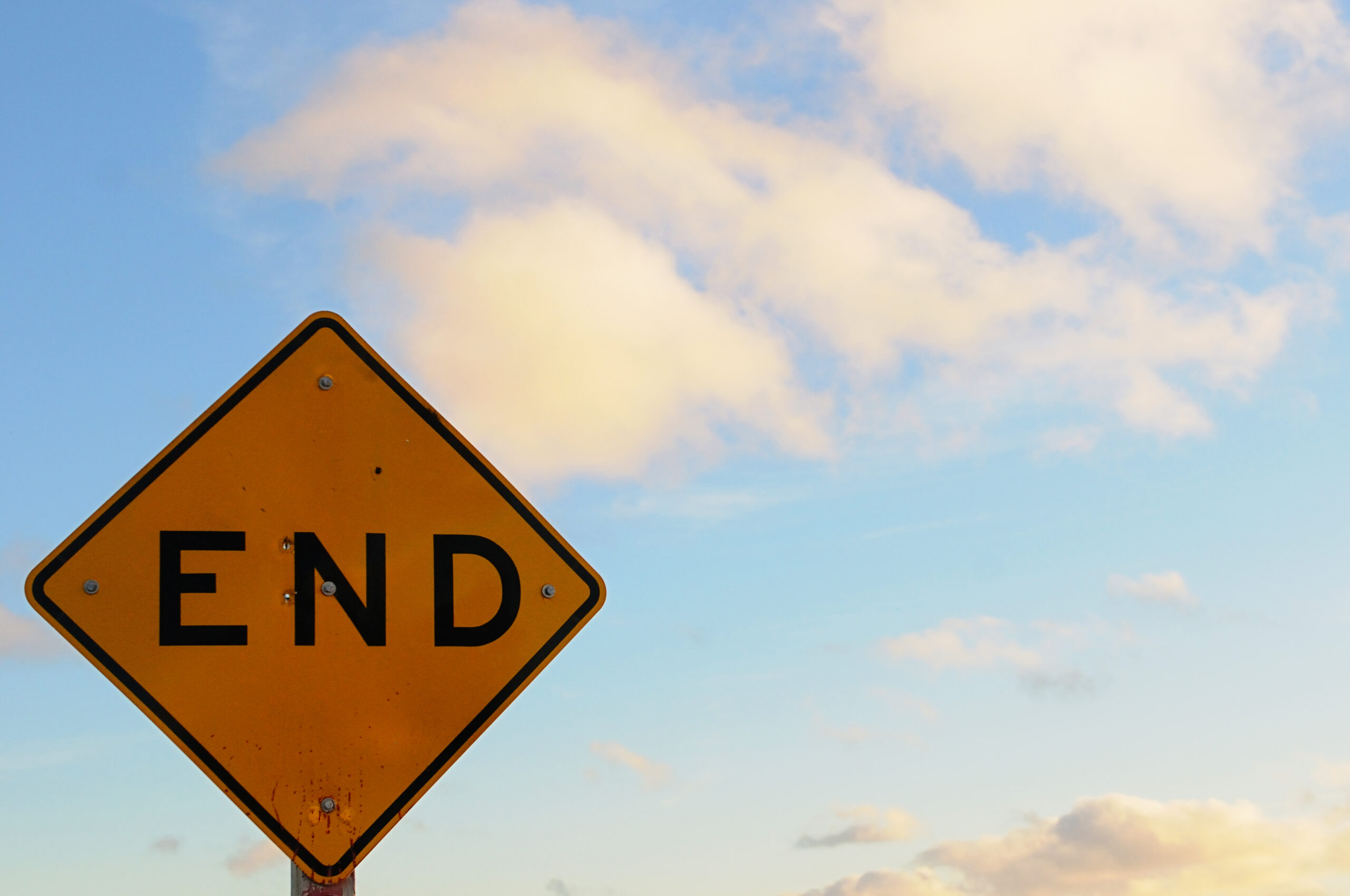 The image shows a sign with the words "The End"
