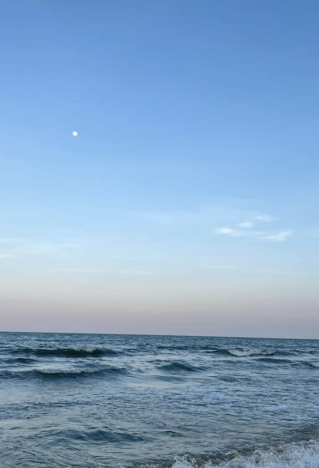This is an image of a beach when the sun has gone down.